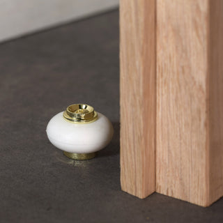 Gulvdørstopper Thirard i messing, 22×30 mm